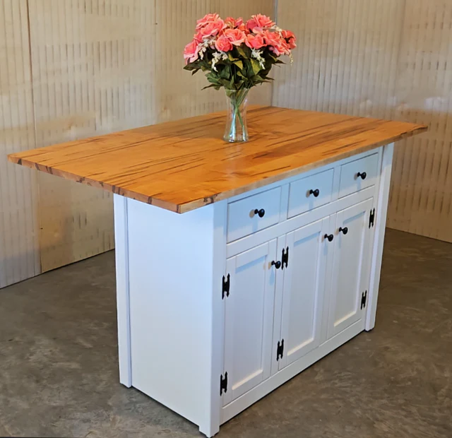 x"Handmade Amish kitchen island with a solid wood top, white base, black hardware, and spacious storage, ideal for modern rustic homes."