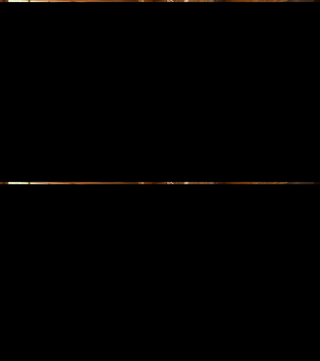 Solid wood Amish-style kitchen island in a rustic farmhouse kitchen with natural light