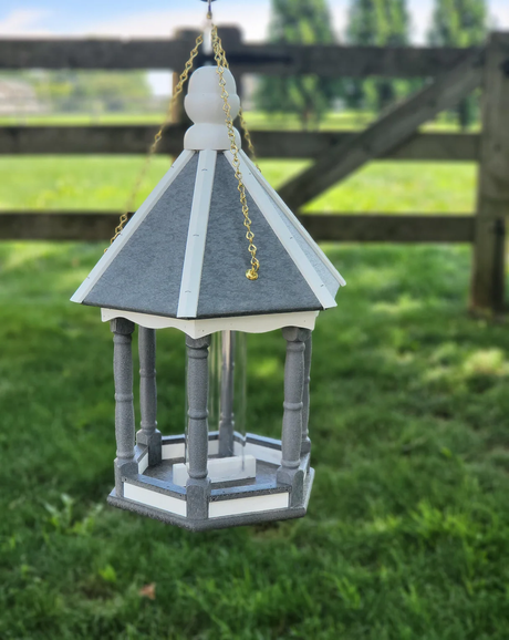 Elegant bird feeder shaped like a gazebo with gray and white details hanging on gold chains