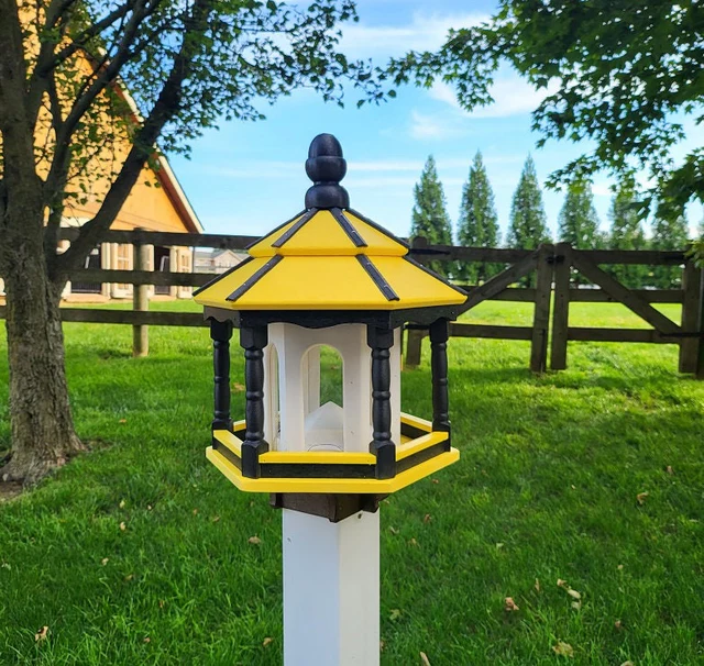 Handcrafted Amish gazebo-style bird feeder in yellow and black, mounted on a white post, perfect for attracting birds to your outdoor space.