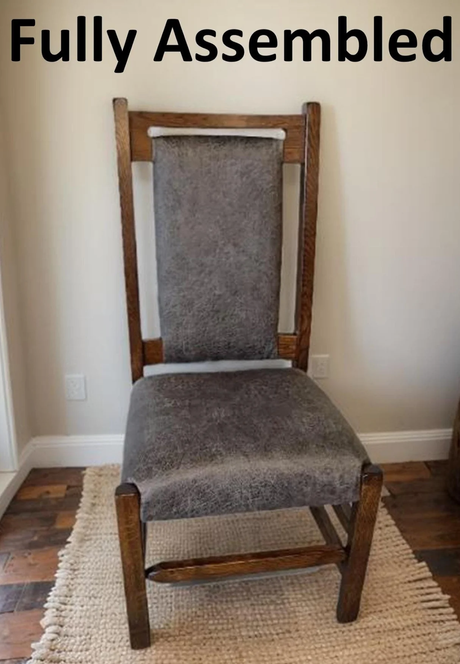 A handcrafted Amish-style handmade dining chair featuring a rustic wooden frame, distressed leather upholstery, and a high-back design, fully assembled for convenience.